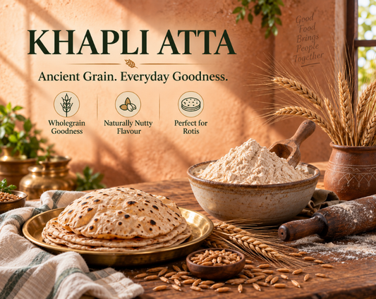 Stone-ground khapli wheat atta with whole khapli wheat grains in a rustic bowl